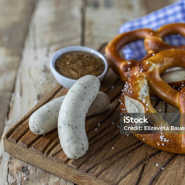 Beer Fest food. Bavarian meal . White sausages, brezel and sweet mustard on wooden table