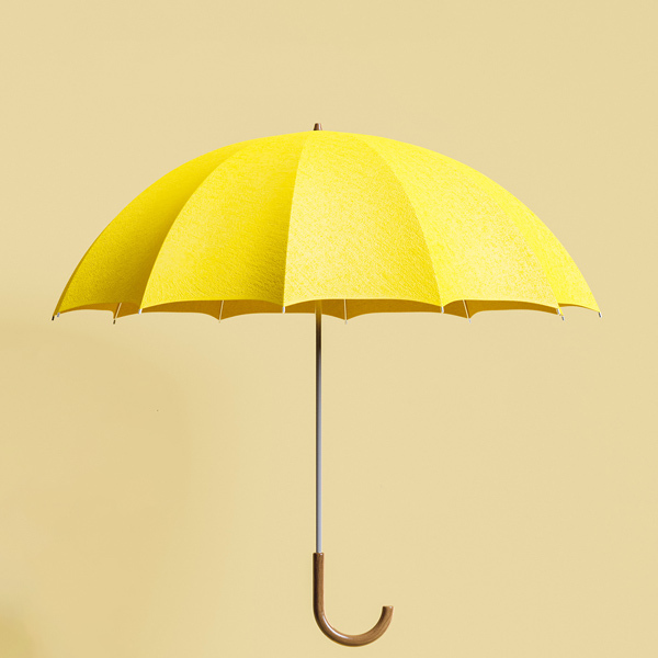 Gelber aufgespannter Regenschirm