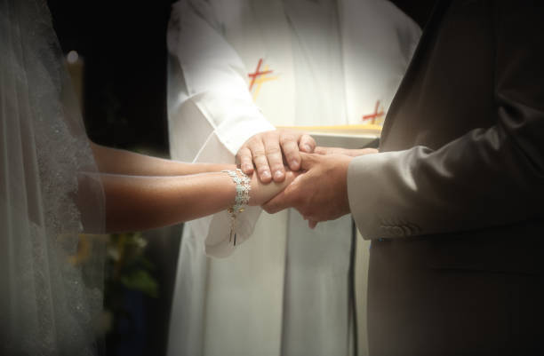 Benediction of the hands of the bride and groom during a religious ceremony