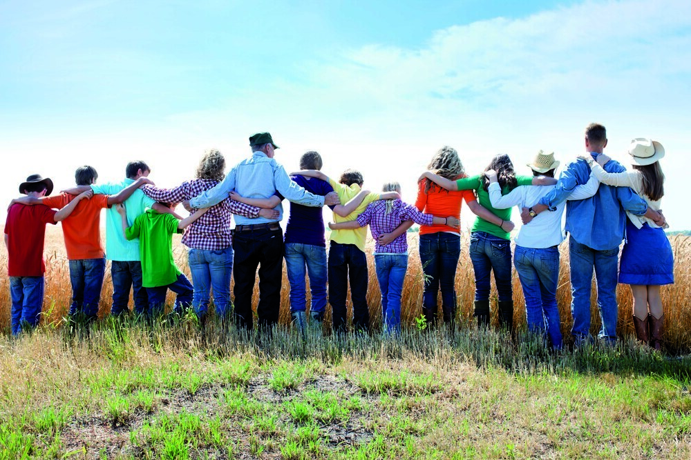 A joyful family offers thanks to God for the success of their wheat crop on their farm. Represents faith, 'down home' family values and an ethic of hardwork and love.