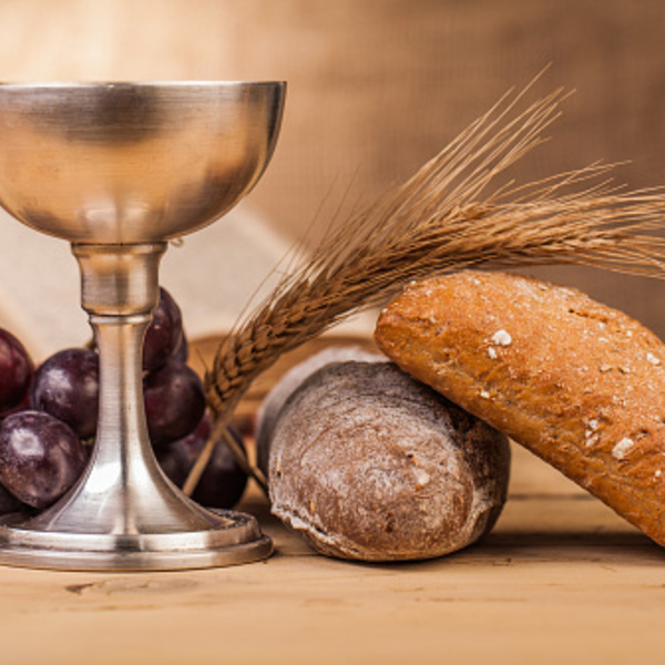 holy communion chalice on wooden table