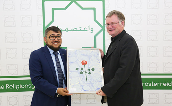 IRG-Vorsitzender Murat Baser und Bischof Manfred Scheuer